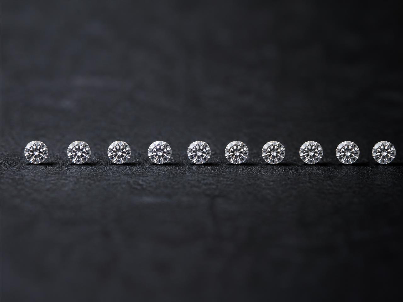 Calibrated layout of matched white diamonds on a dark surface